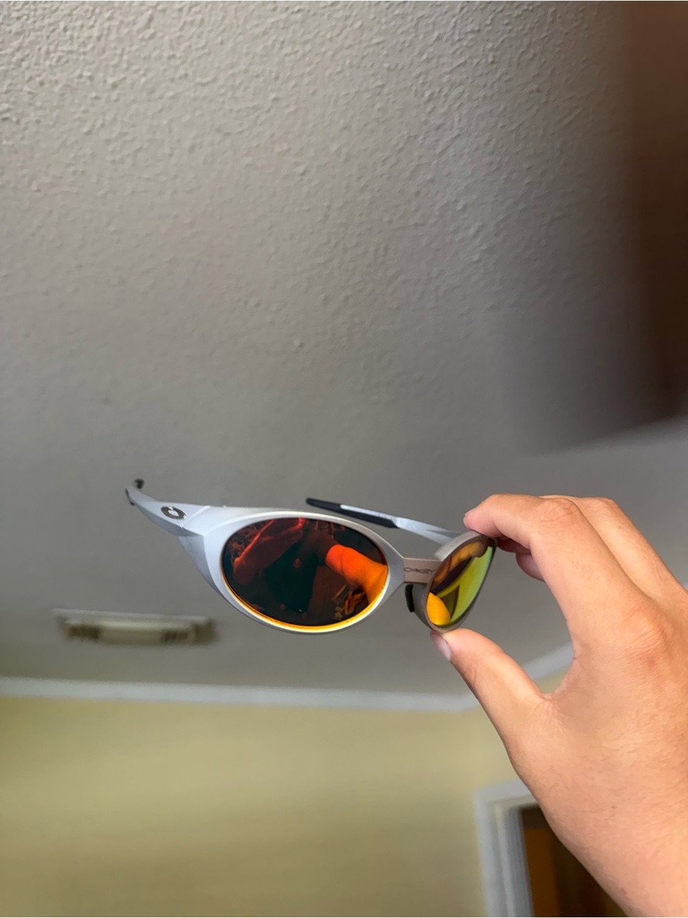 Oakley Silver Frame Sunglasses with Orange/Yellow Mirrored Lenses Oakley
